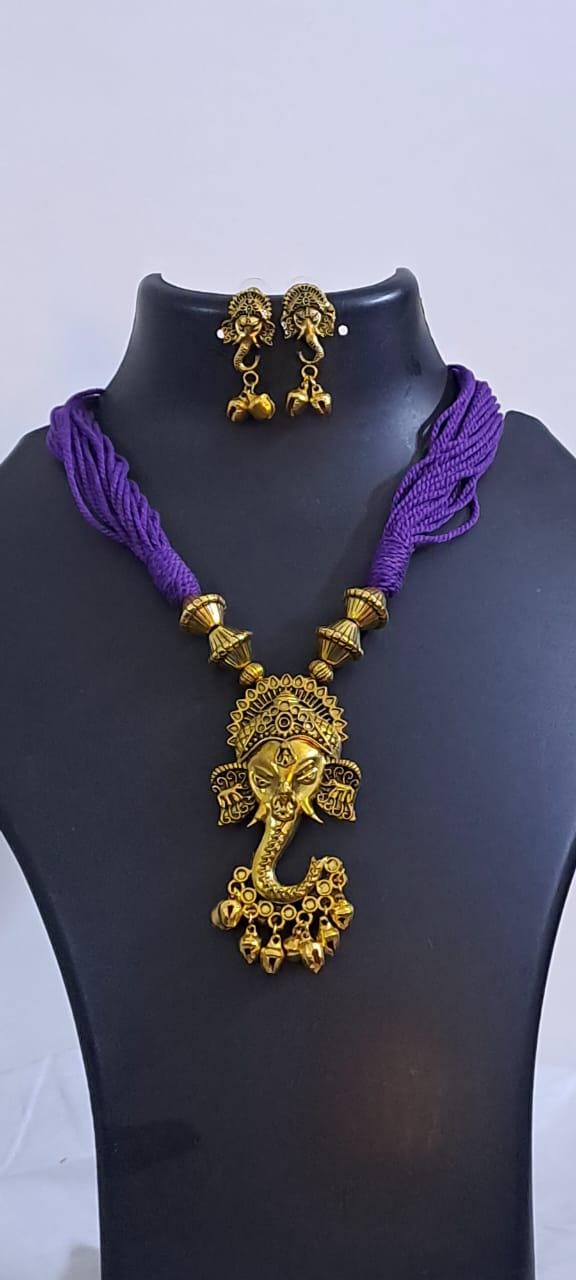 Purple thread necklace with Golden oxidised traditional pendant