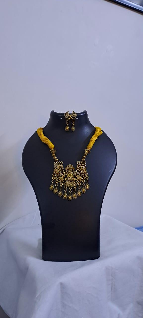 Yellow thread necklace with Golden oxidised traditional pendant