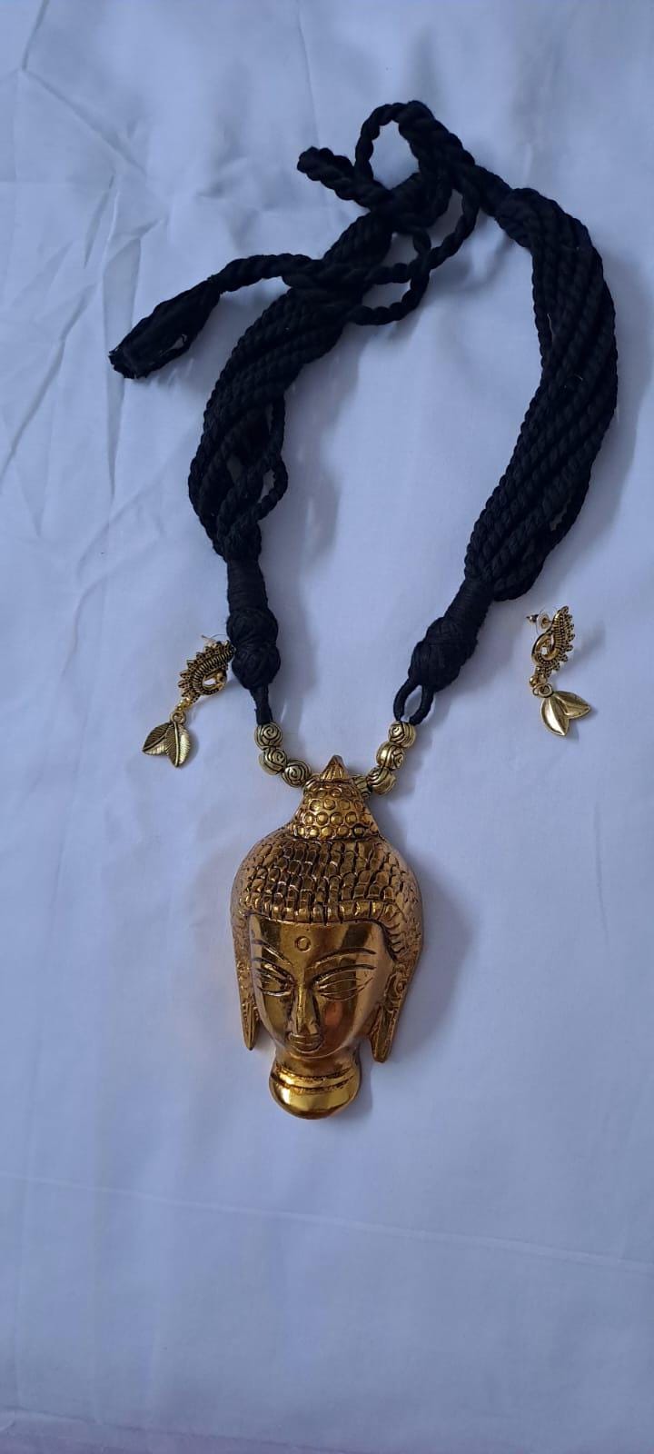 Black thread necklace with oxidised golden buddha pendant