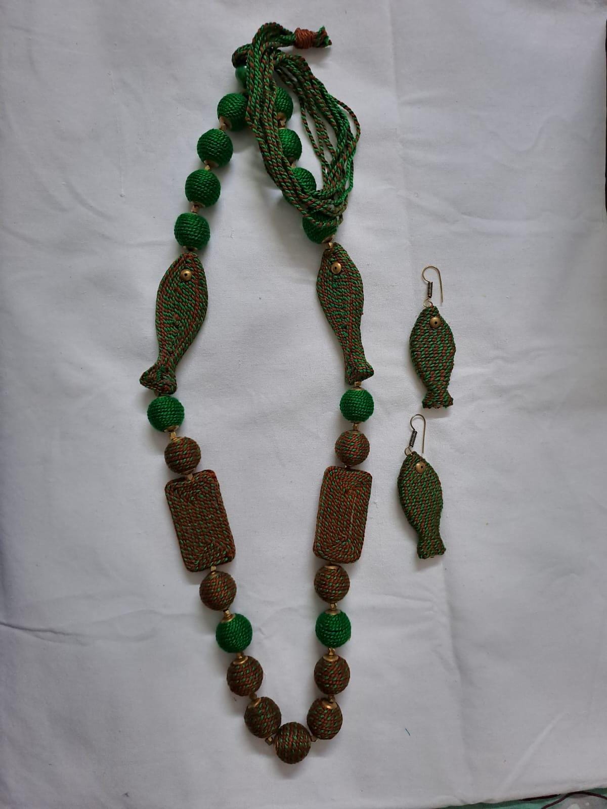 Exclusive brown n green thread necklace with fish shape thread beads and matching earrings.