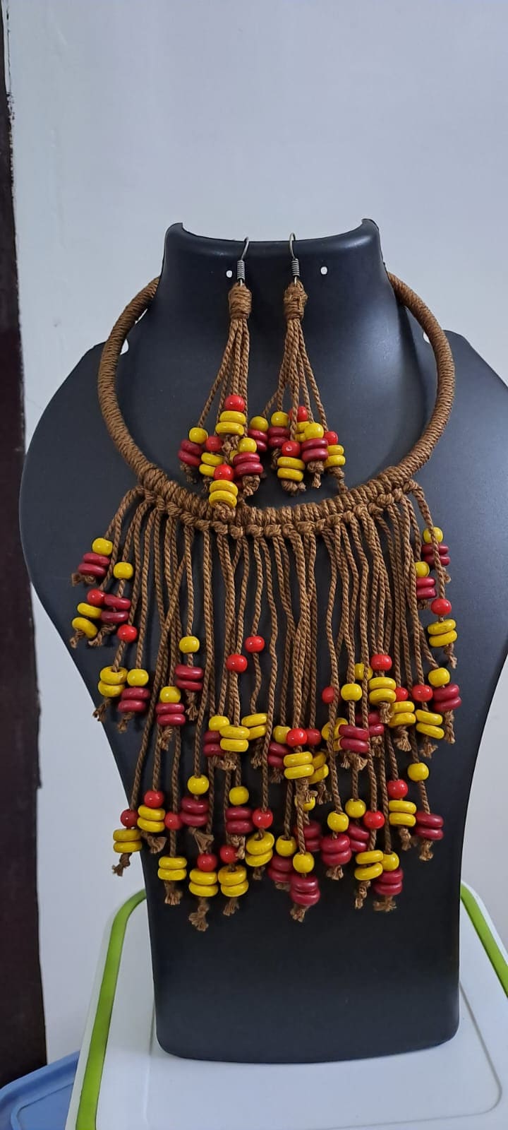 Exclusive brown thread neckband with fringes and matching earrings.