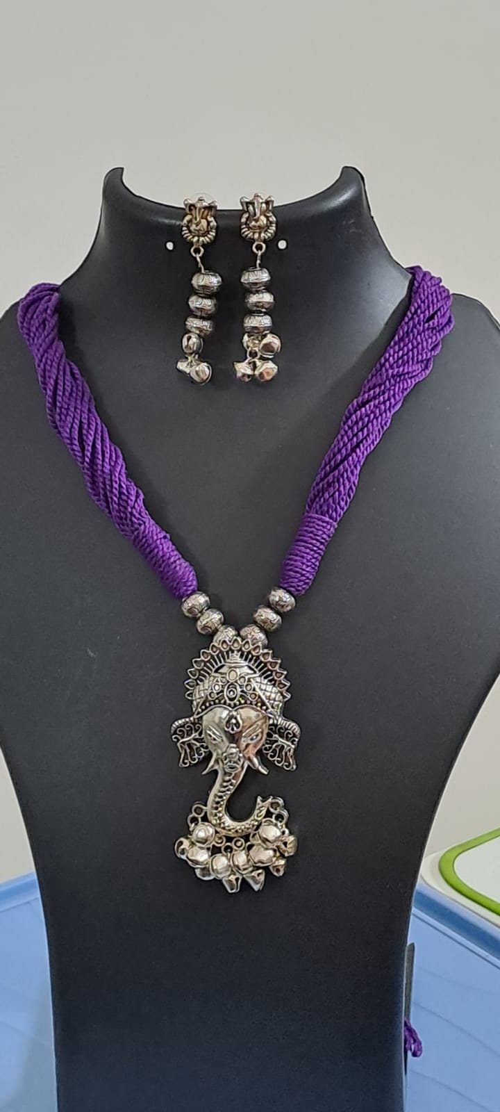 Purple thread necklace with oxidised silver ganesha pendant