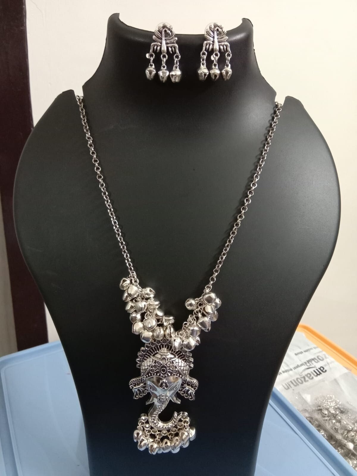 Oxidised silver chain with traditional pendant and matching earrings.