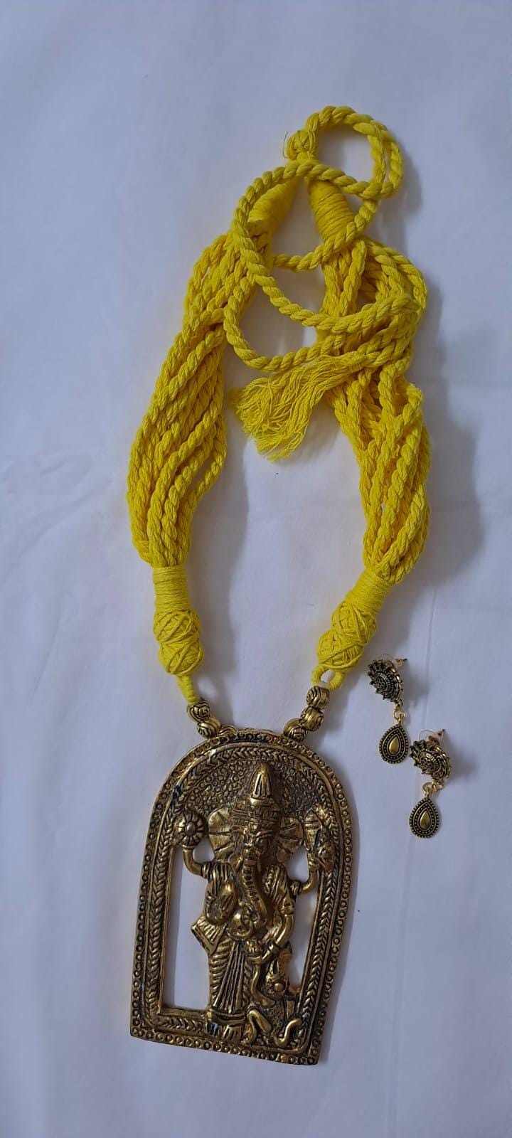 Yellow thread necklace with golden oxidised ganesha pendant