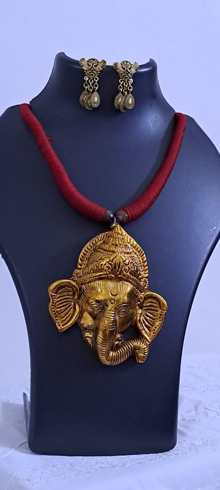 Maroon thread necklace with golden oxidised ganesha pendant
