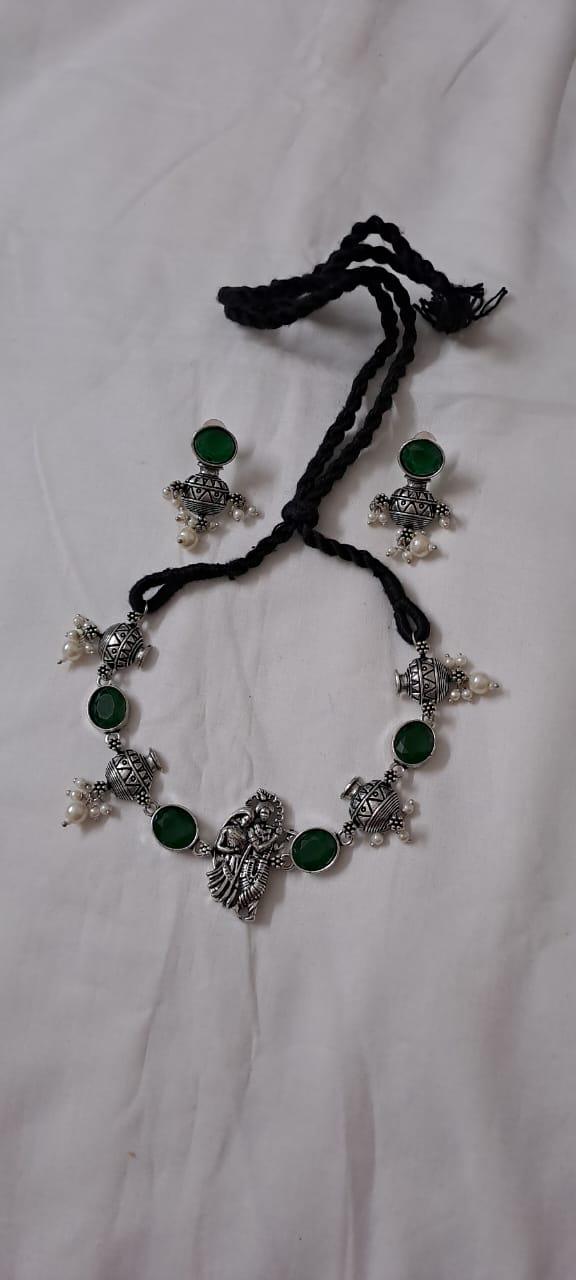 Exclusive silver oxidised lstone necklace with radha krishna pendant with matching earrings