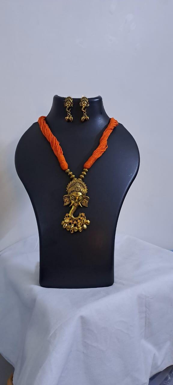 Orange thread necklace with Golden oxidised traditional pendant