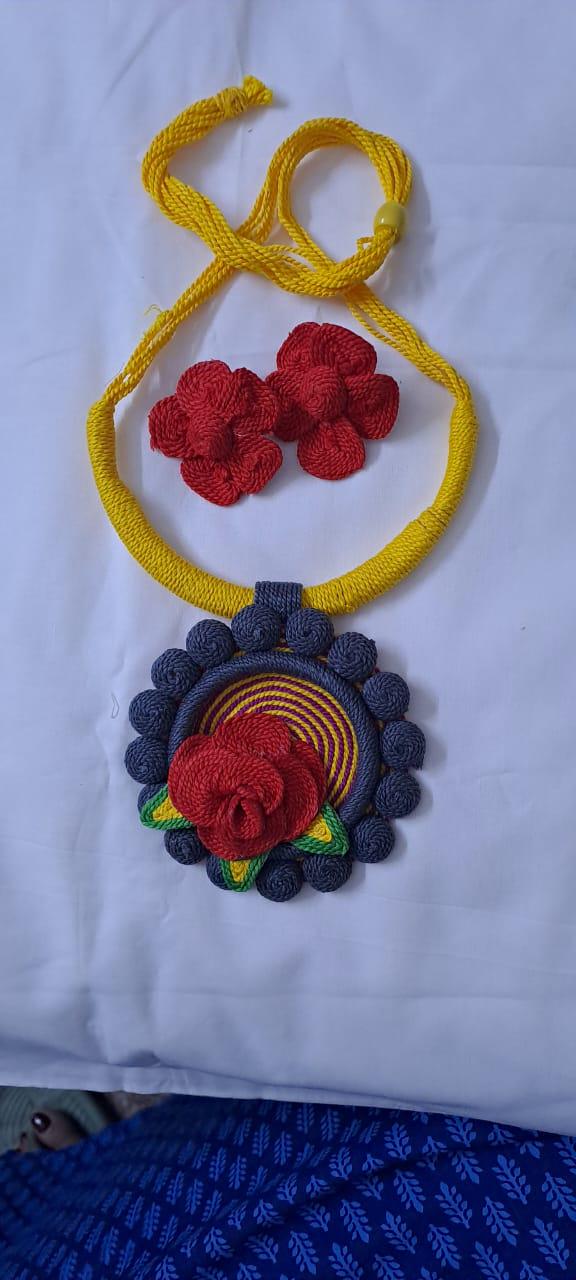 Exclusive multicoloured thread necklace set with round thread pendant n matching flower earrings