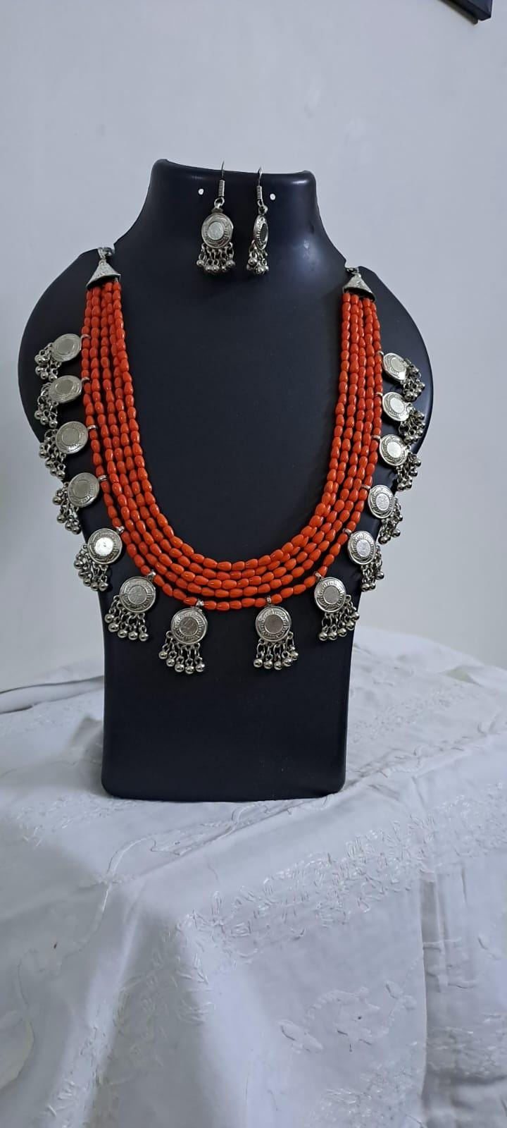 Exclusive multi layered  orange glass beads necklace set with silver oxidised charms n matching earrings