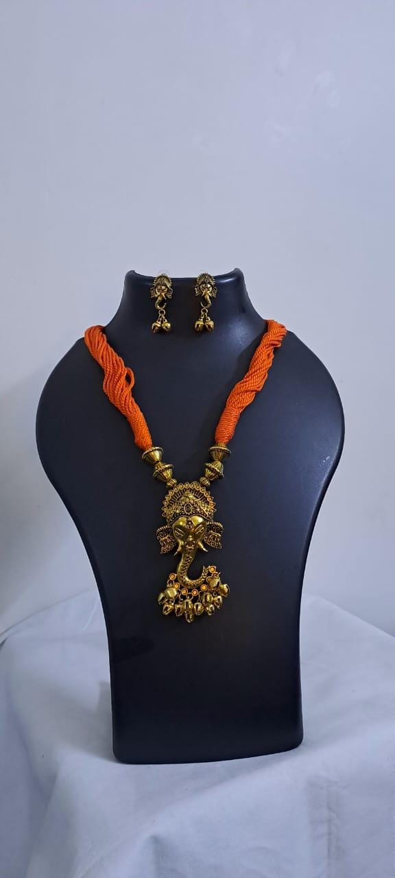Orange thread necklace with Golden oxidised traditional pendant