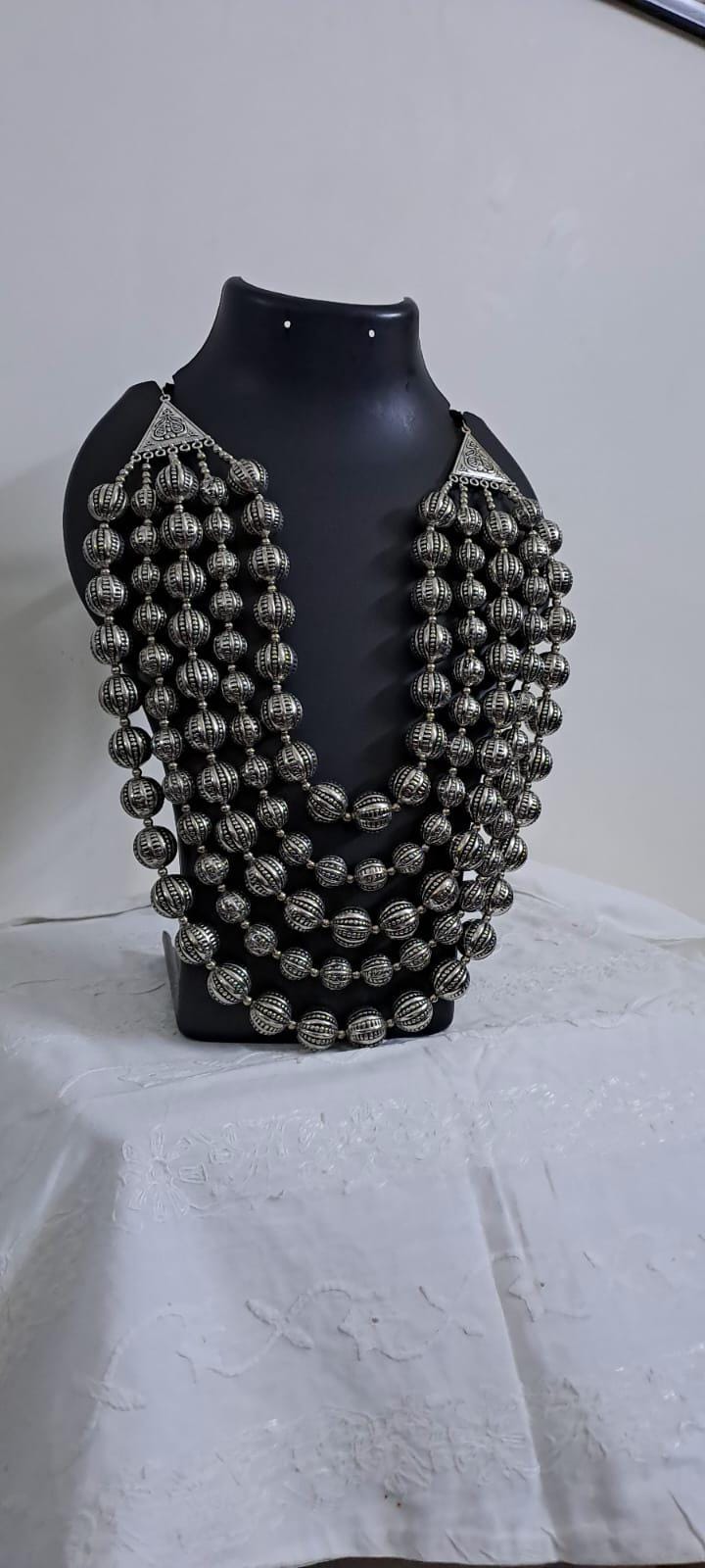 Multi-layered silver oxidised beads necklace .