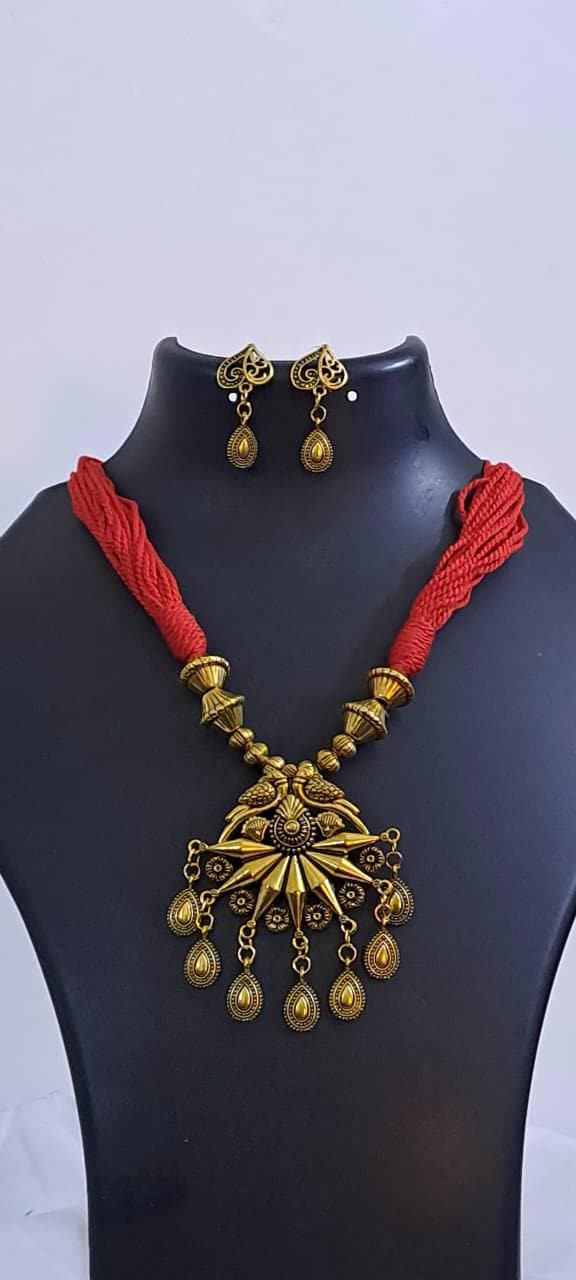 Red thread necklace with Golden oxidised traditional pendant