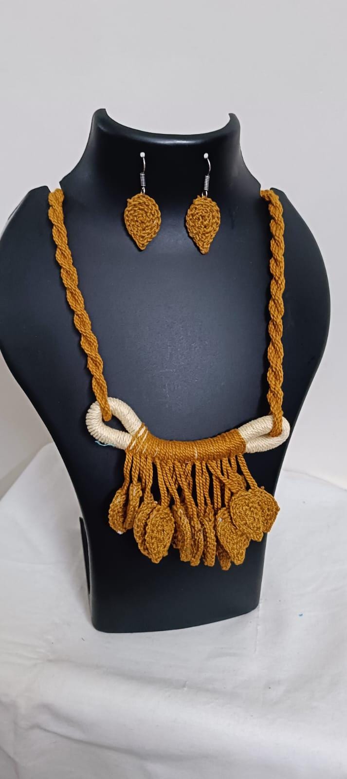 Golden brown Crochet thread necklace set with leaf fringes and matching earrings