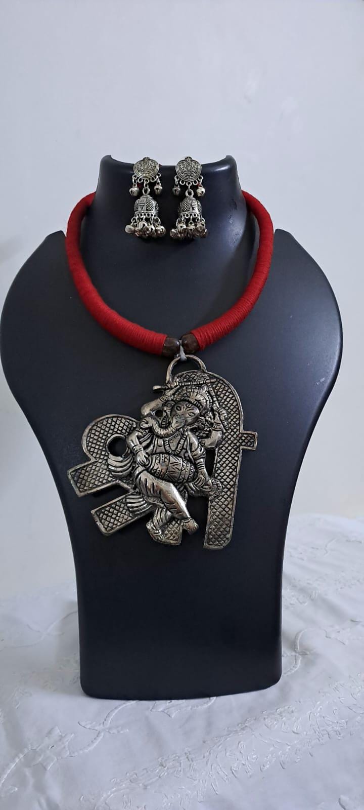 Red thread necklace with silver oxidised ganesha pendant