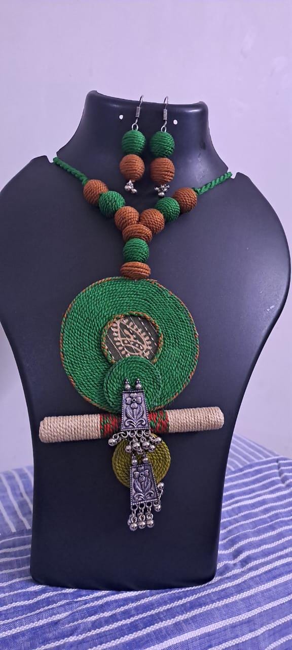 Exclusive green n brown thread beads necklace set with round thread n silver oxidised pendant n matching earrings