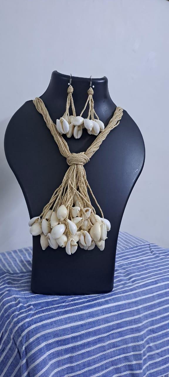 Multi layered jute necklace with shell fringes and with matching earrings.