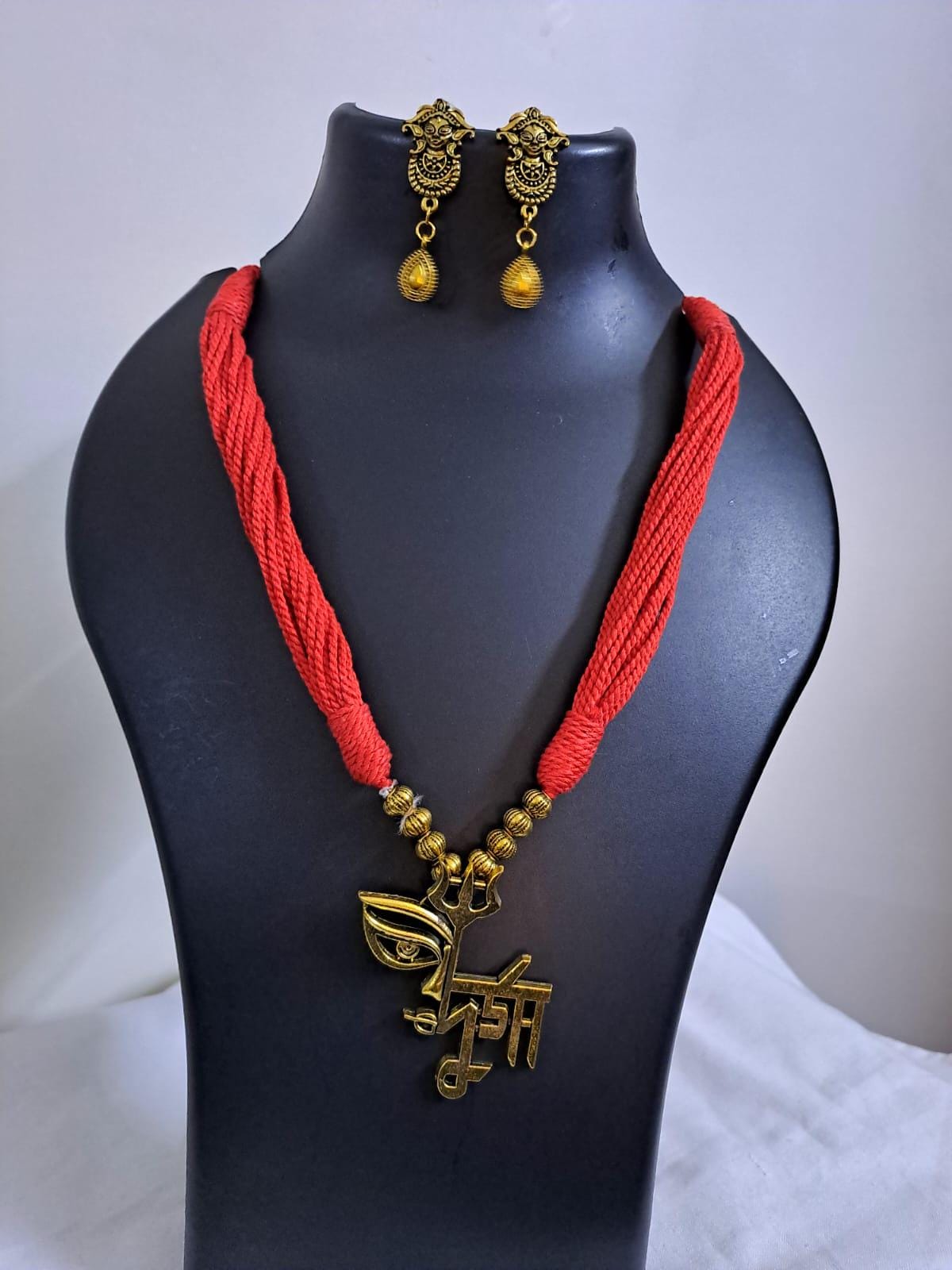 Red thread necklace set with golden oxidised Durga pendant n matching earrings