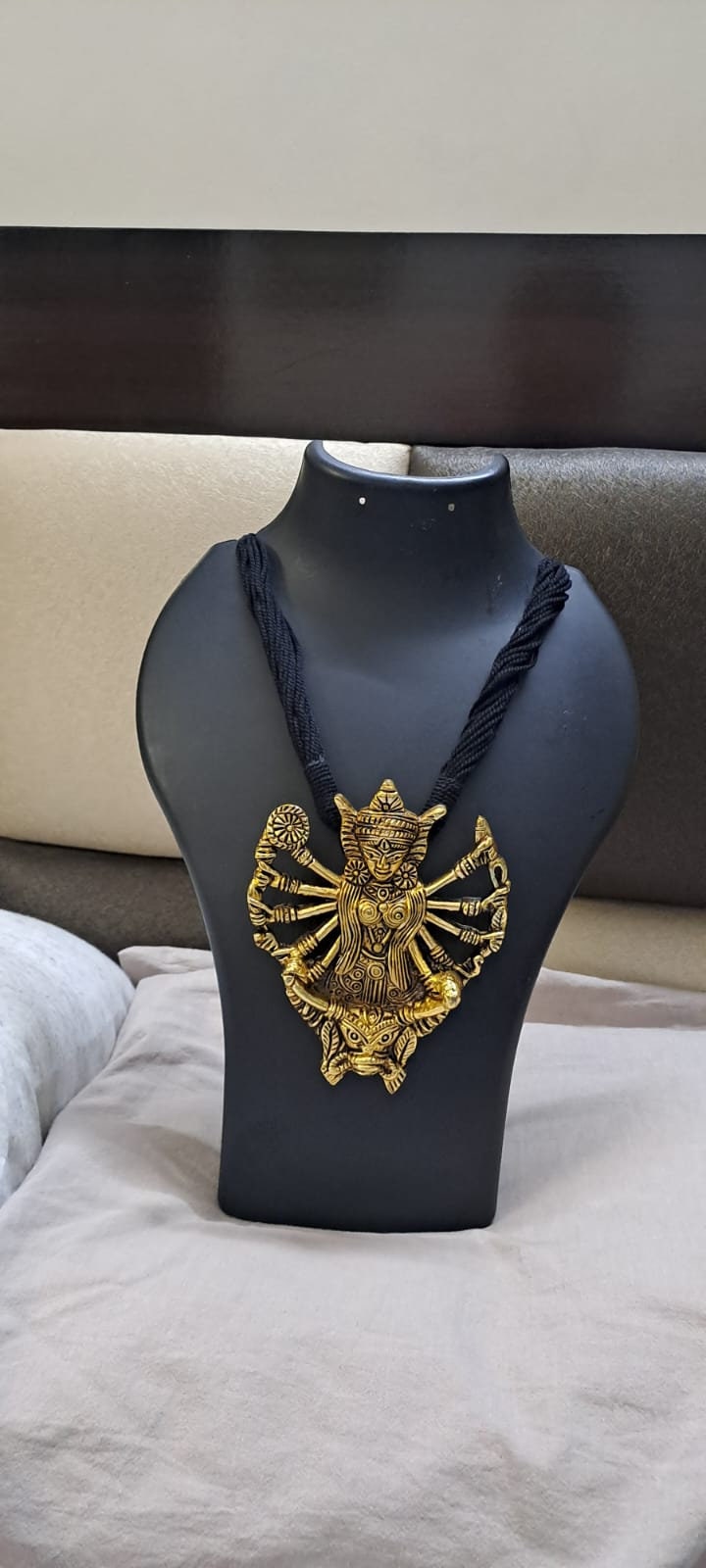 Black thread necklace with oxidised golden durga pendant