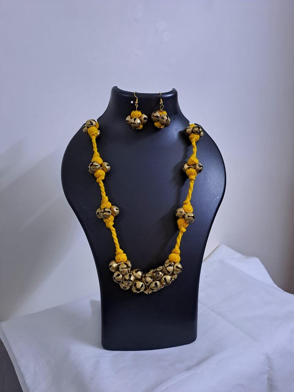 Yellow thread necklace with trinkets n matching earrings
