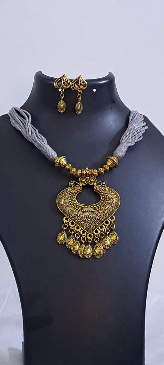 Grey thread necklace with Golden oxidised traditional pendant