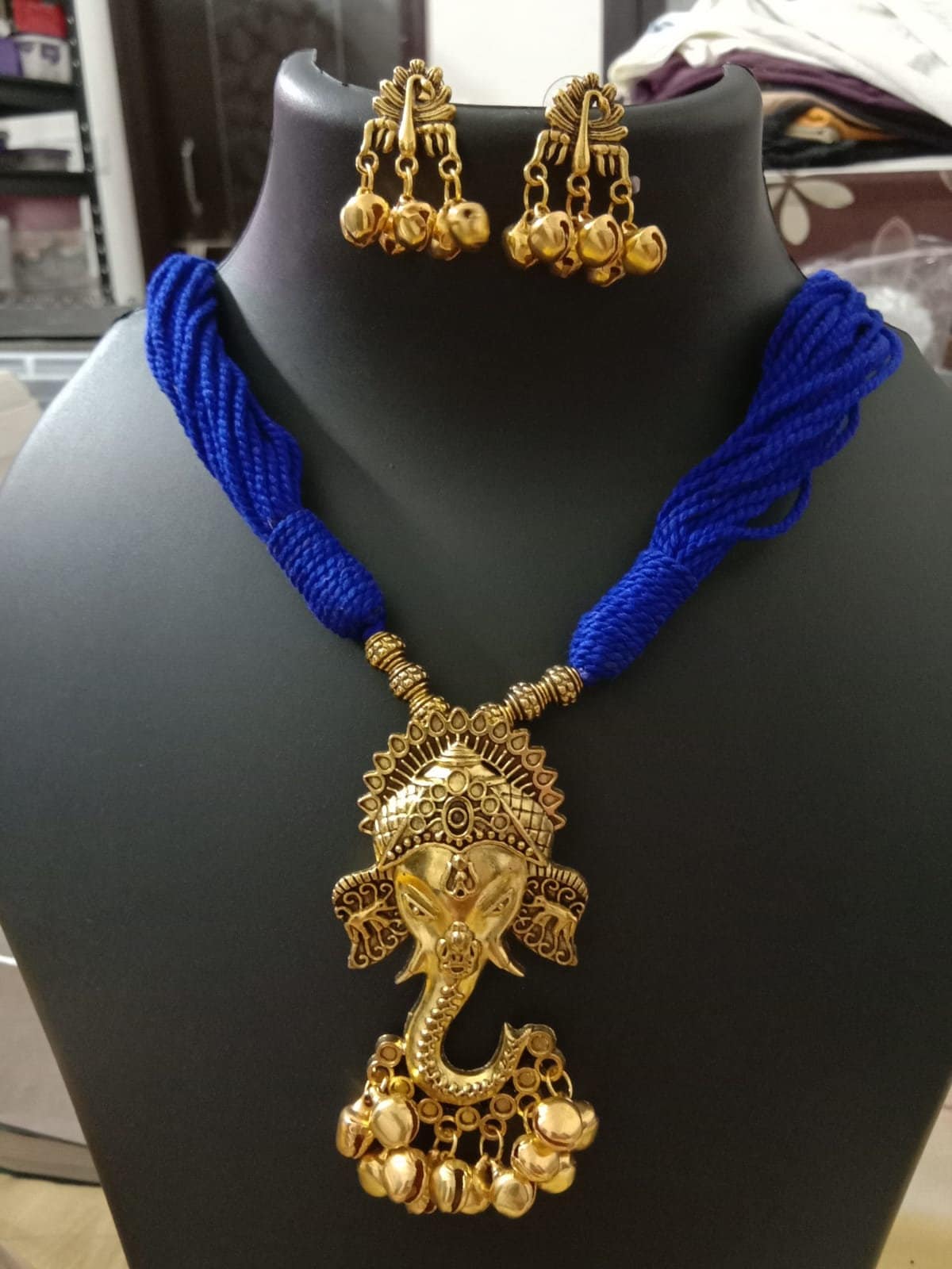Oxidised golden ganesha traditional pendant and matching earrings.