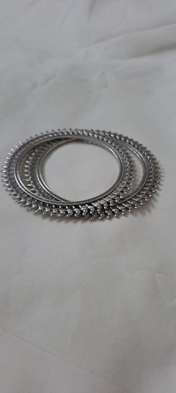 Traditional silver oxidised bangles with birds border.