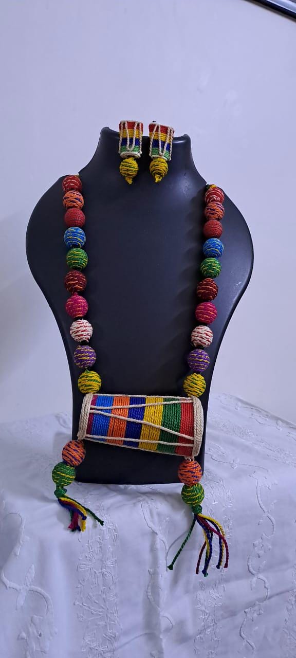 Multi coloured thread beads necklace set with dholak pendant and matching earrings