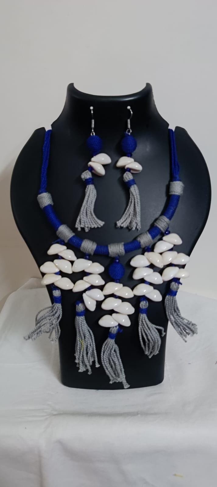 Exclusive blue n grey hasuli thread necklace set with shell fringes n matching earrings