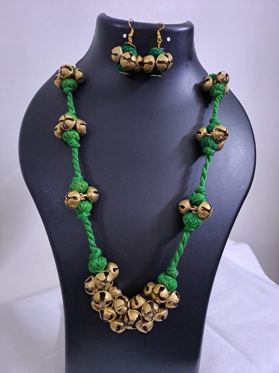 Green thread necklace set with trinkets n matching earrings