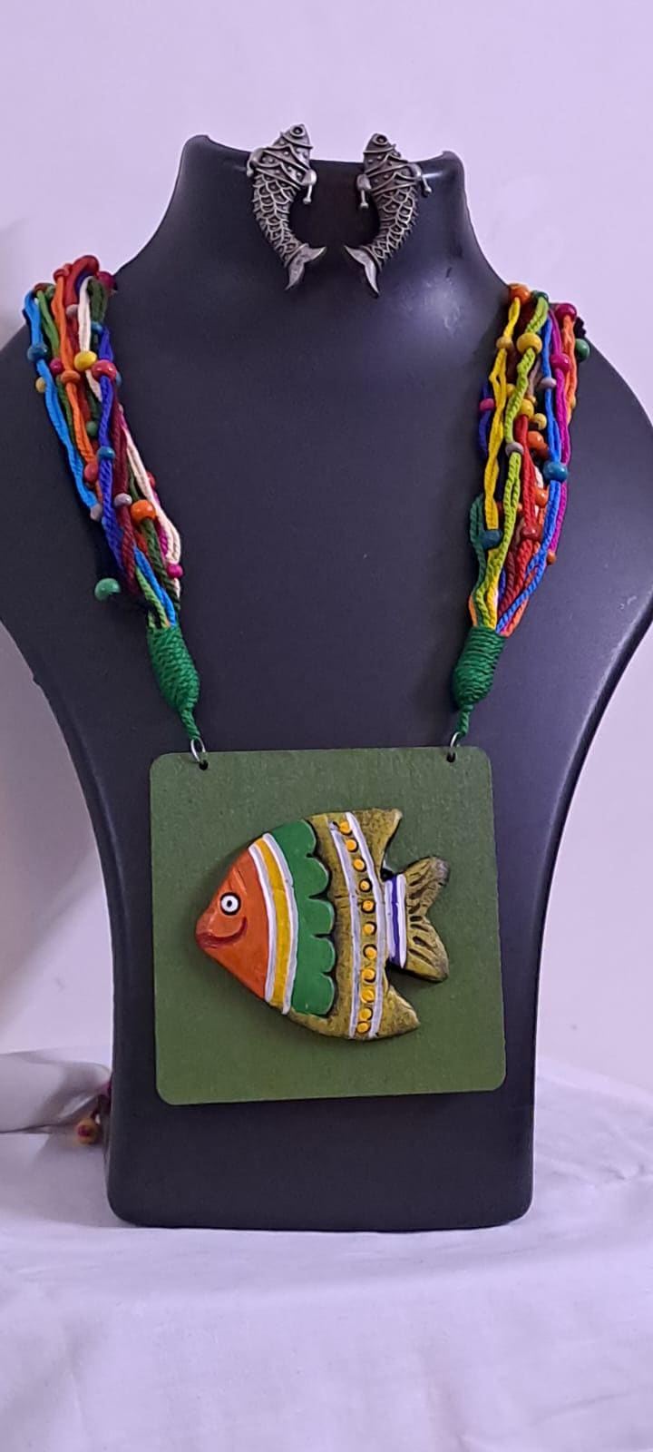 Terracotta fish pendant and thread necklace
