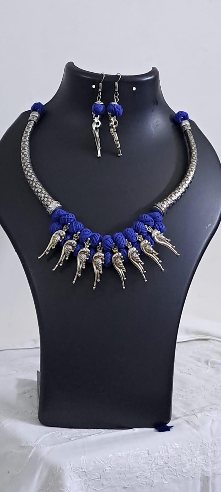 Blue thread necklace with kolhapuri silver oxidised traditional beads and matching earrings