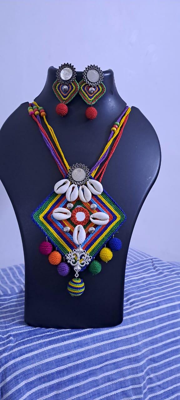 Exclusive multicoloured thread necklace set with shell n thread pendant n matching earrings