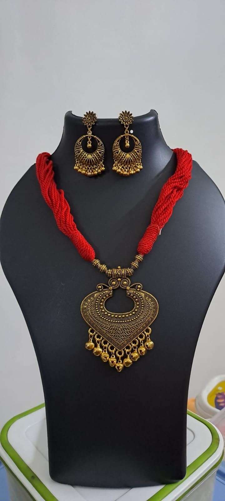 Red thread necklace with Golden oxidised traditional pendant