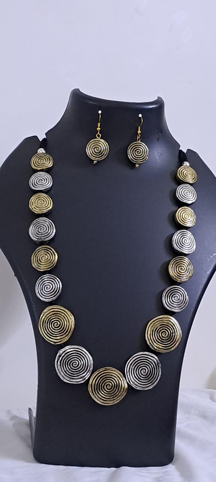 Exclusive silver oxidised set with flat round beads of gold n silver tone mix n matching earrings