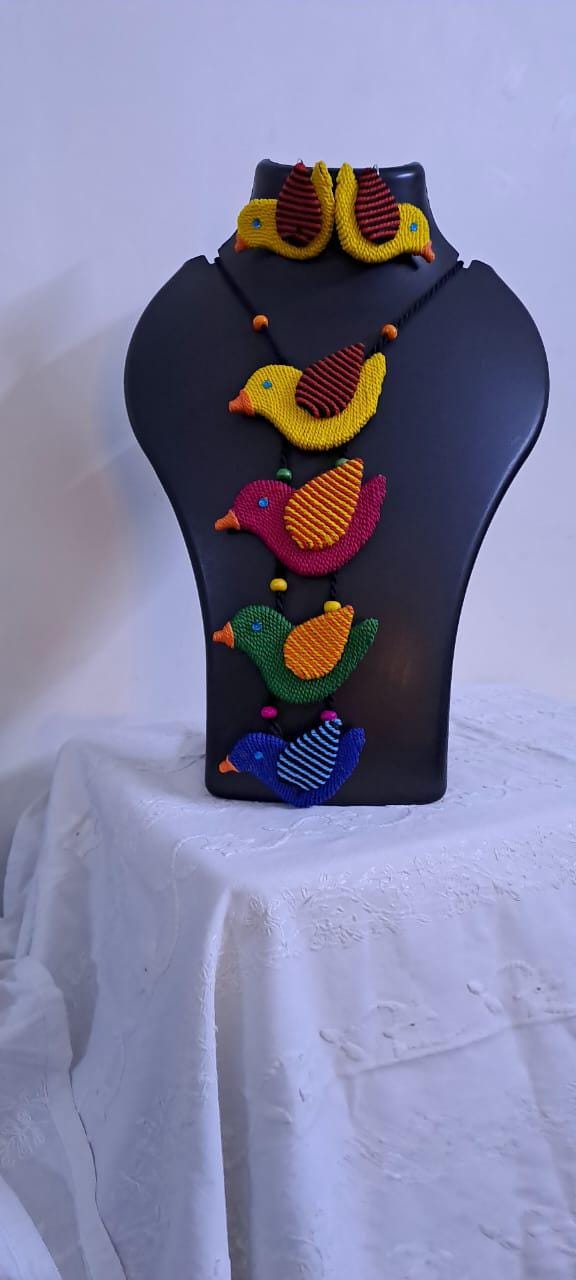 Multi coloured bird necklace and matching earrings