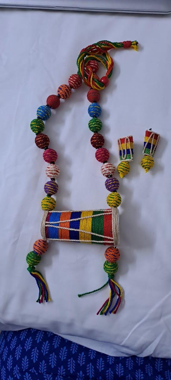 Multi coloured thread beads necklace set with dholak pendant and matching earrings