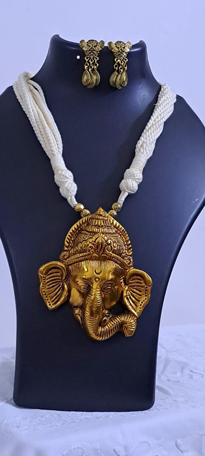 Off-white thread necklace with golden oxidised ganesha pendant