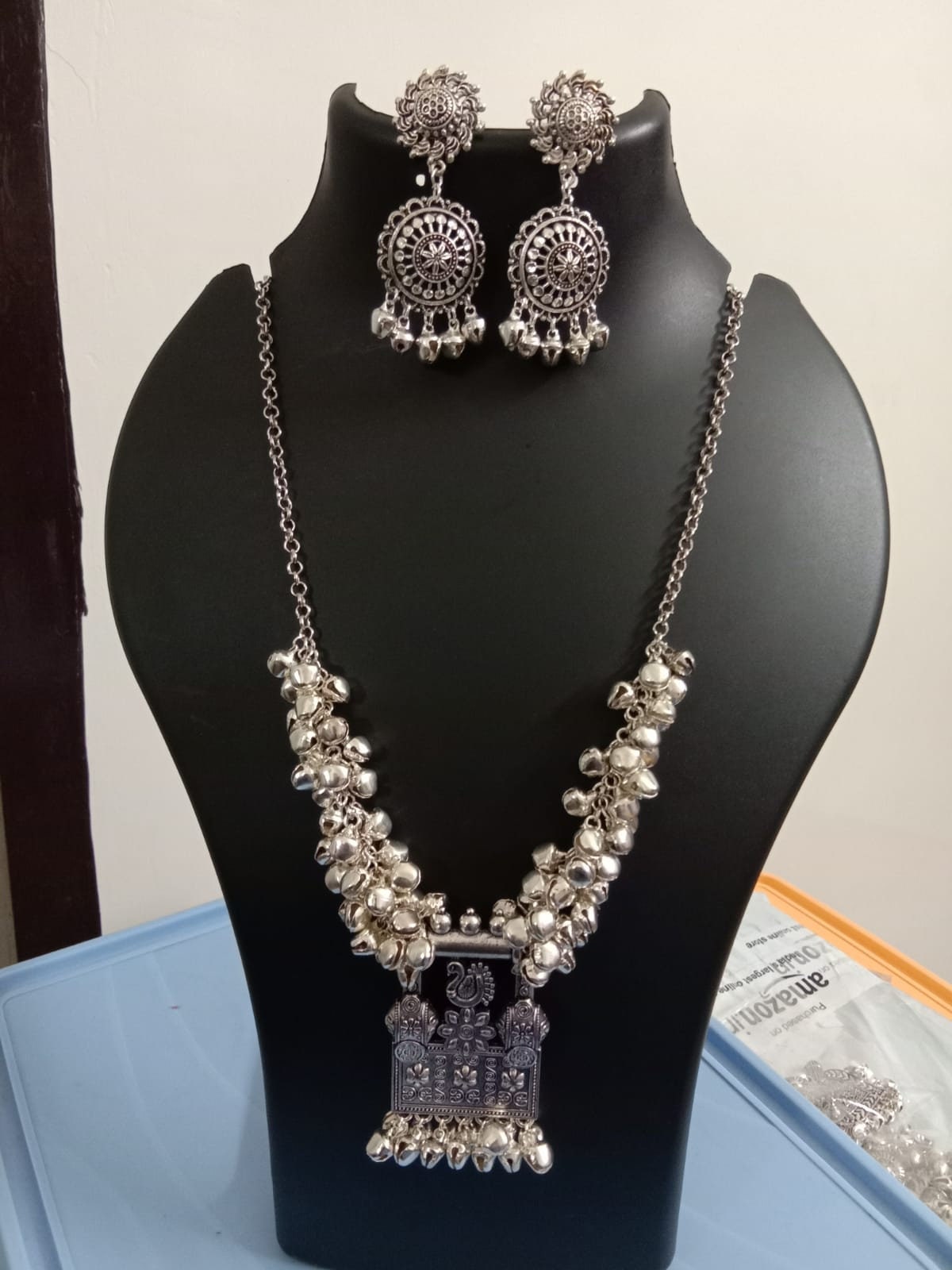 Oxidised silver chain with traditional pendant and matching earrings.