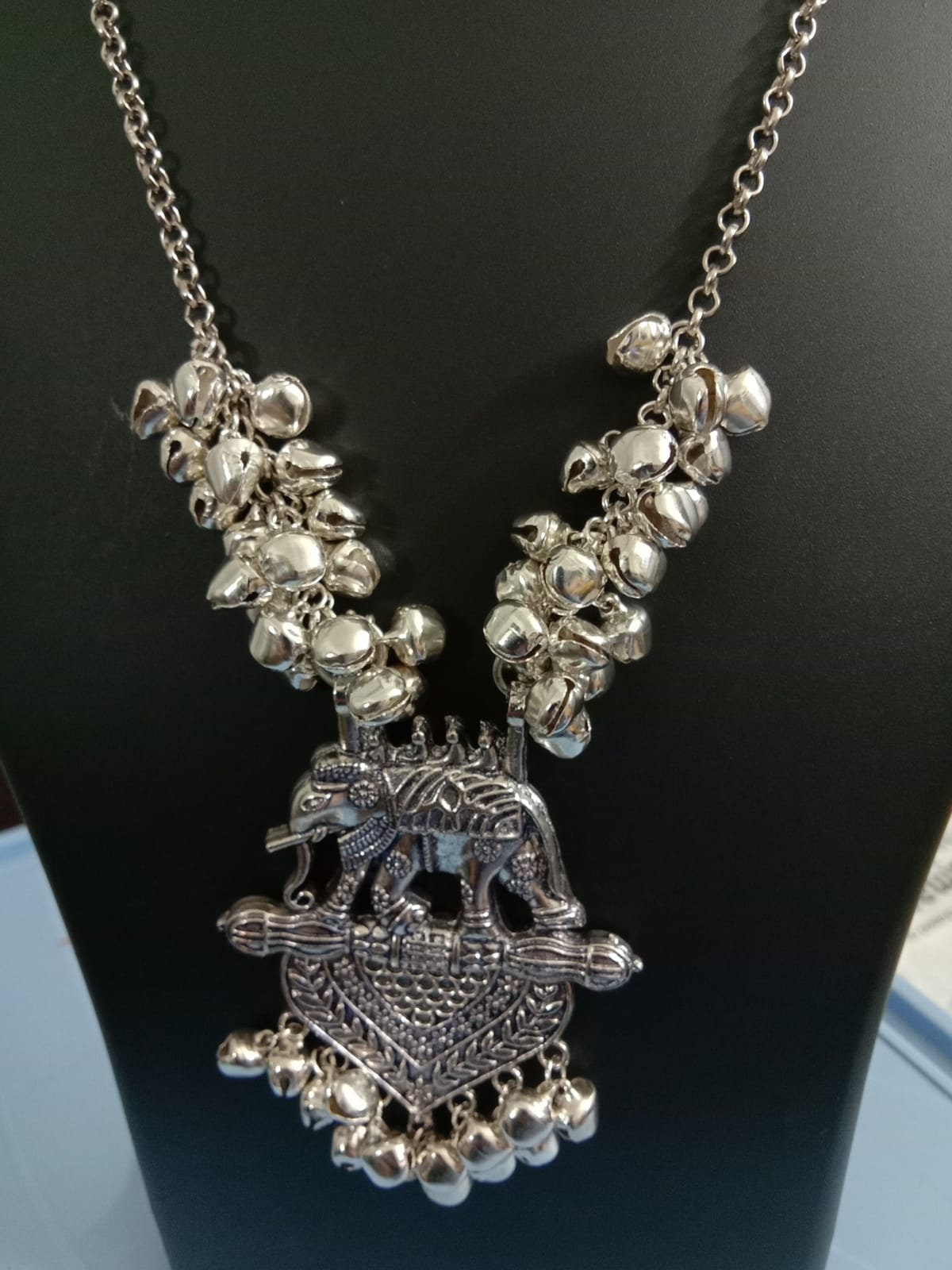 Oxidised silver chain with traditional pendant and matching earrings.