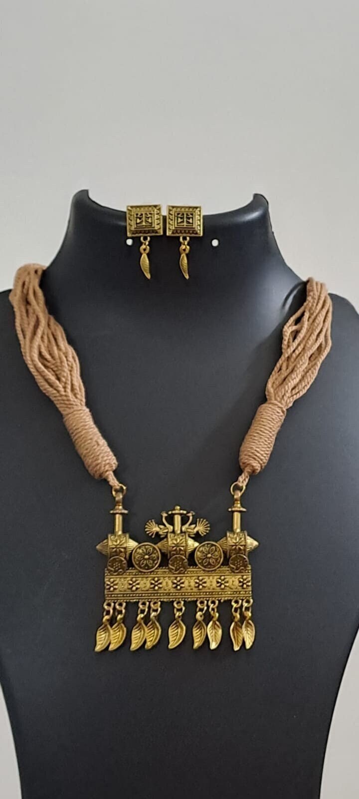 Peach thread necklace with Golden oxidised traditional pendant