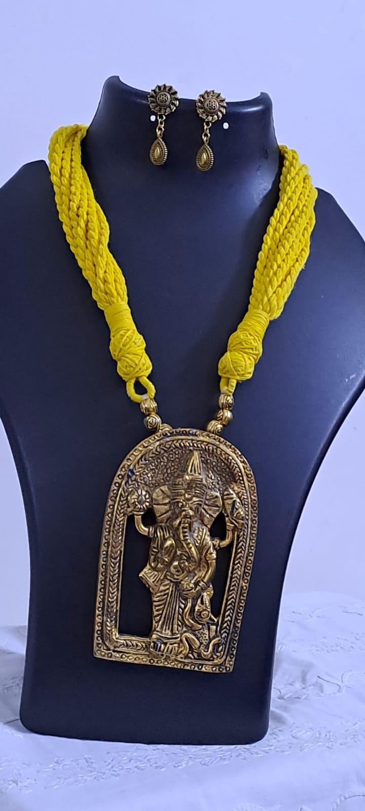 Yellow thread necklace with golden oxidised ganesha pendant