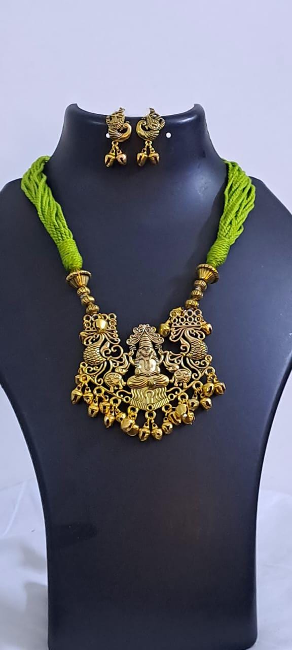 Light green thread necklace with Golden oxidised traditional pendant