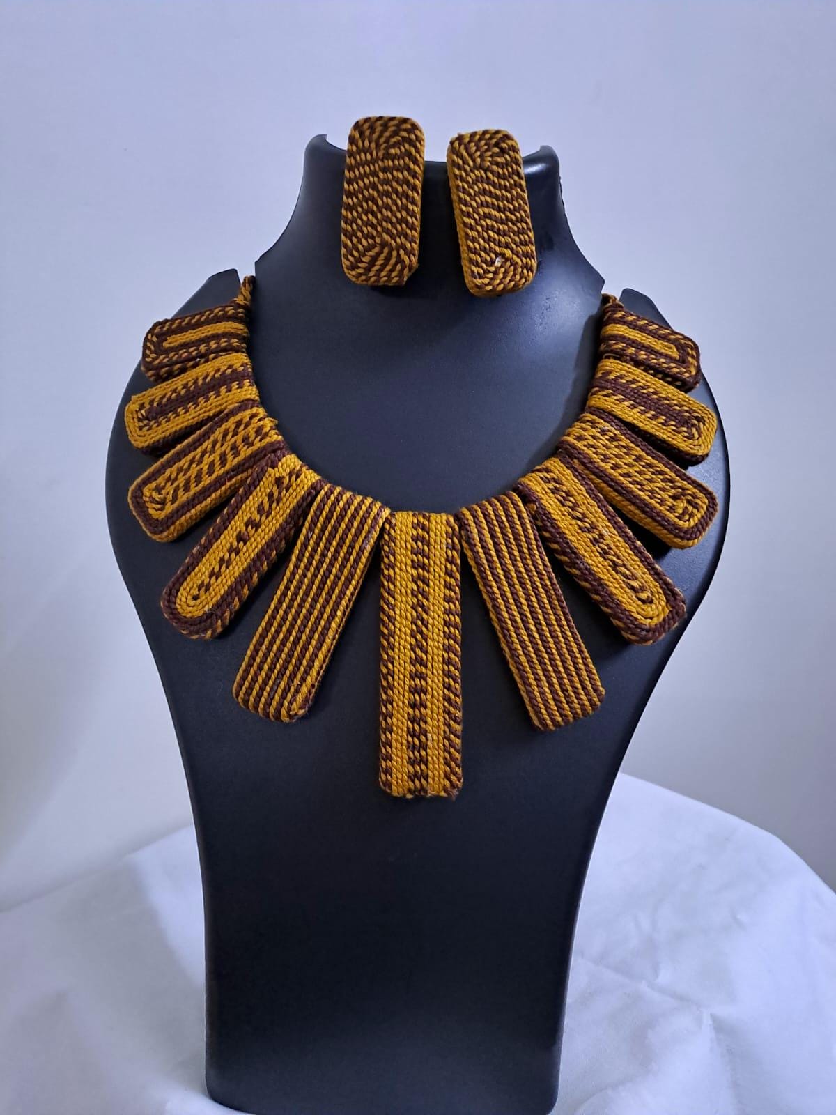 Exclusive brown n yellow thread necklace with rectangle shape thread beads and matching earrings.