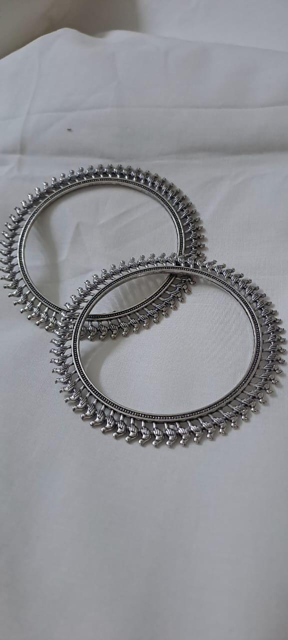 Traditional silver oxidised bangles with birds border.