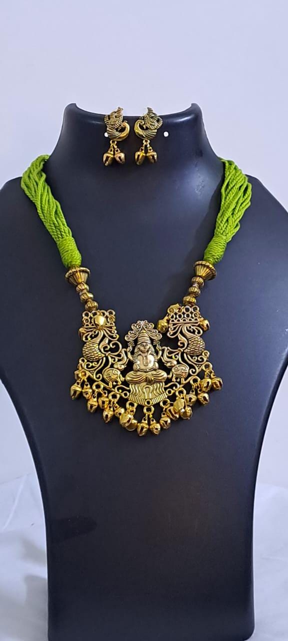 Light green thread necklace with Golden oxidised traditional pendant