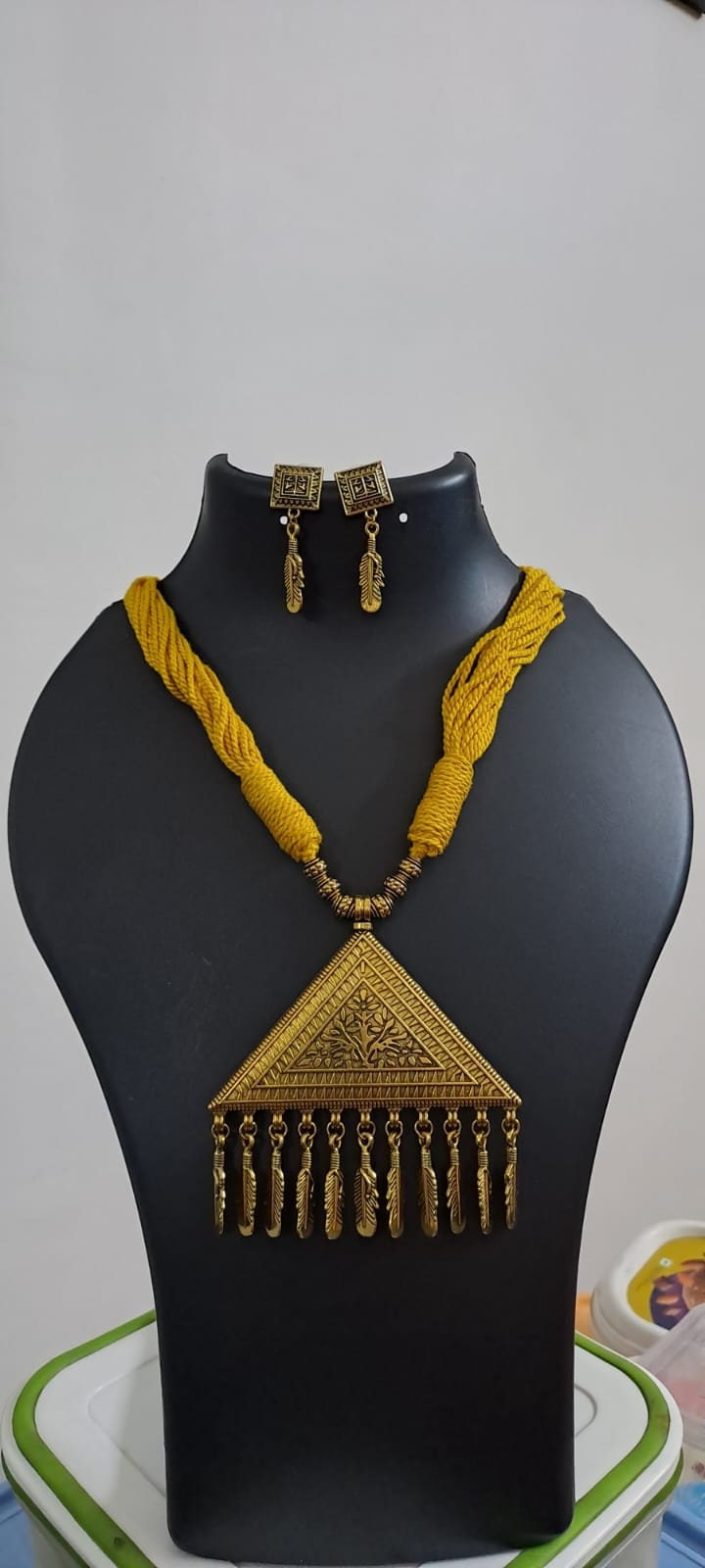 Yellow thread necklace with Golden oxidised traditional pendant