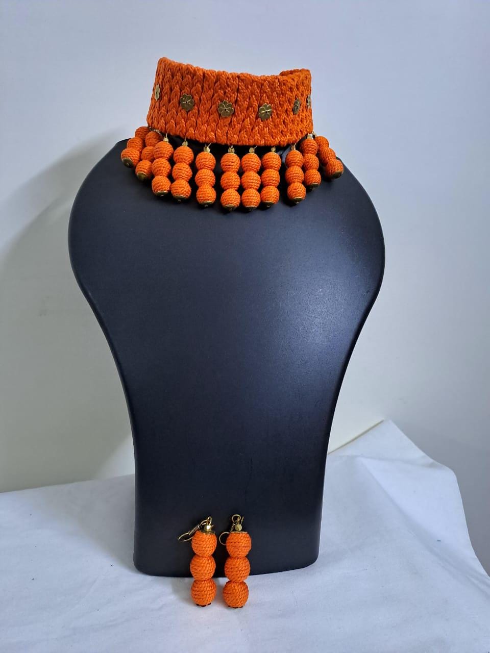 Orange braided choker necklace set with fringes and matching earrings