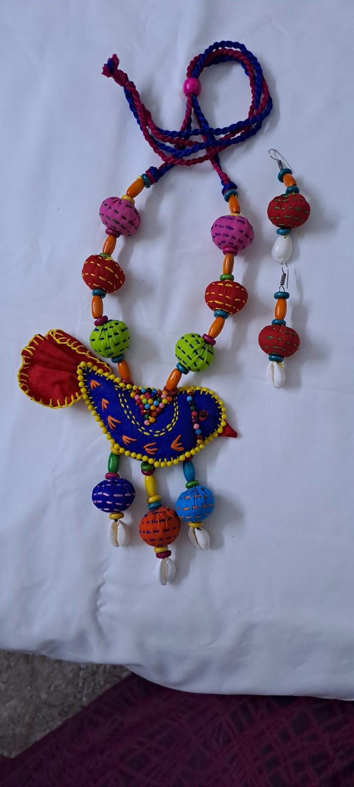 Exclusive fabric necklace with embroidered blue fabric bird pendant and fabric beads n matching beads