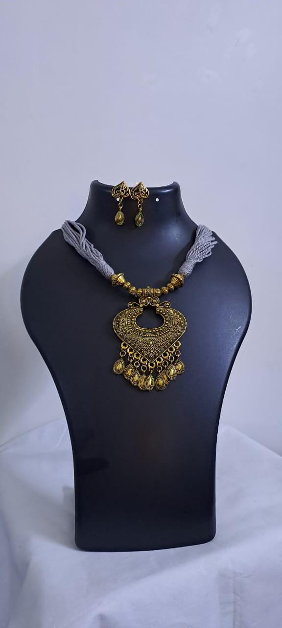 Grey thread necklace with Golden oxidised traditional pendant