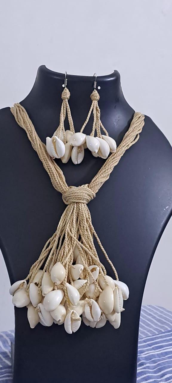 Multi layered jute necklace with shell fringes and with matching earrings.